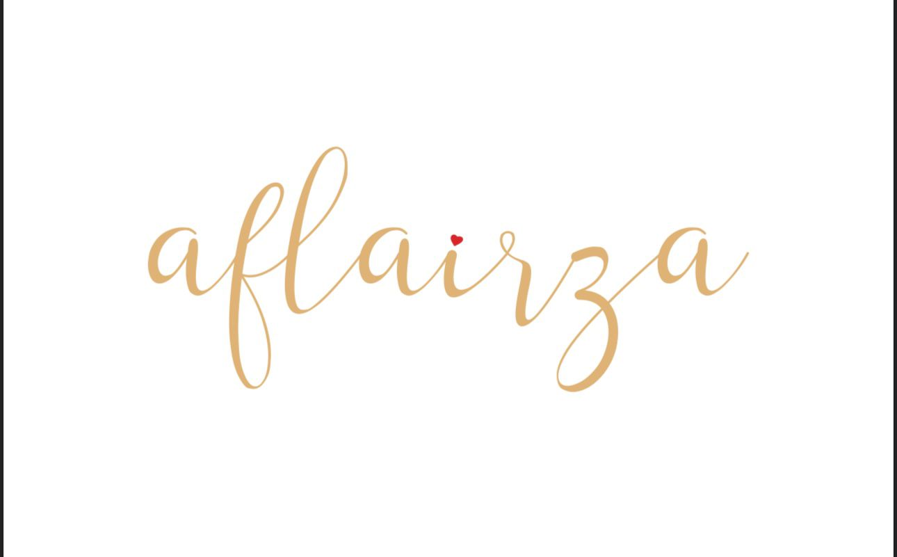 Logo design of the brand name "aflairza" written in elegant golden cursive font with a small red heart above the letter “i,” placed on a white background.